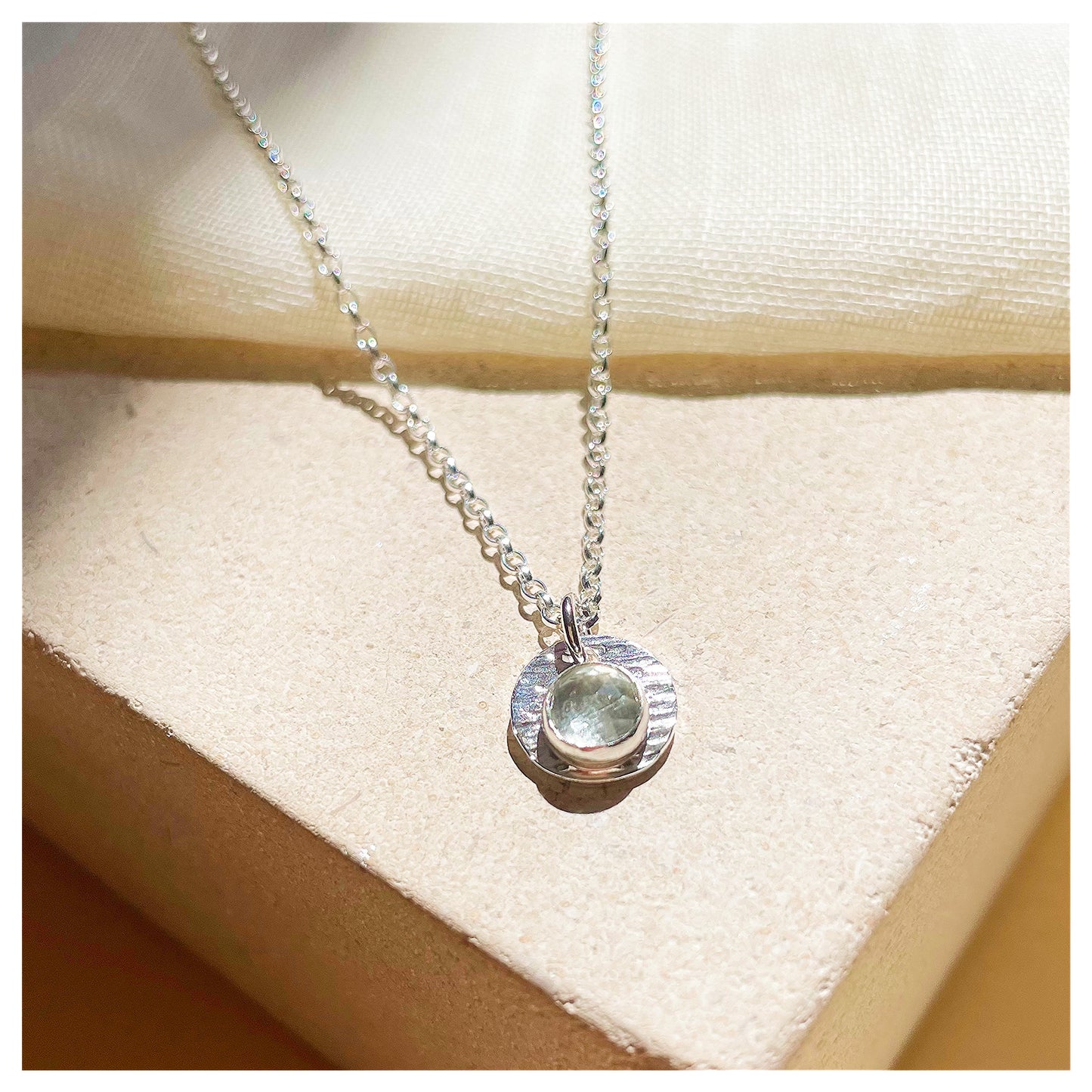 Sterling Silver and Green Amethyst Hammered Disc Pendant.