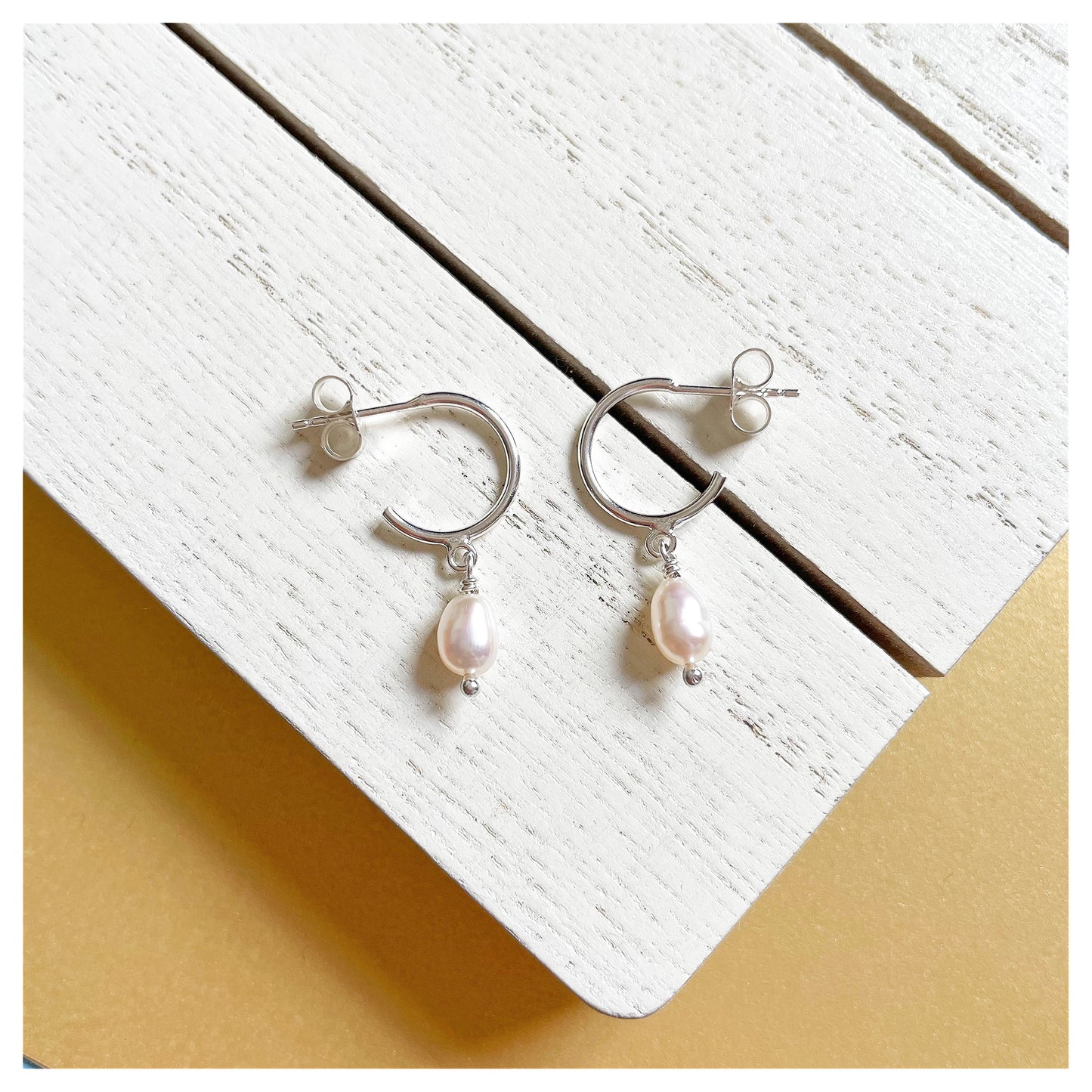 Sterling Silver and Freshwater Pearl Small Half Hoop Earrings.