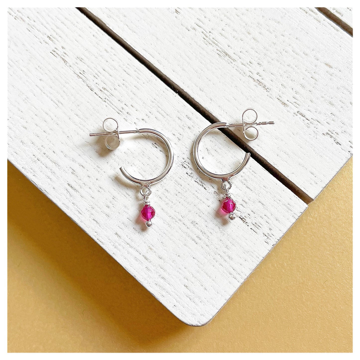 Sterling Silver and Pink Spinel Small Half Hoop Earrings.